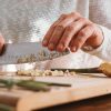 Chopping garlic on a cutting board