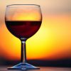 A glass of wine at sunset