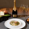 Champagne and food on a table